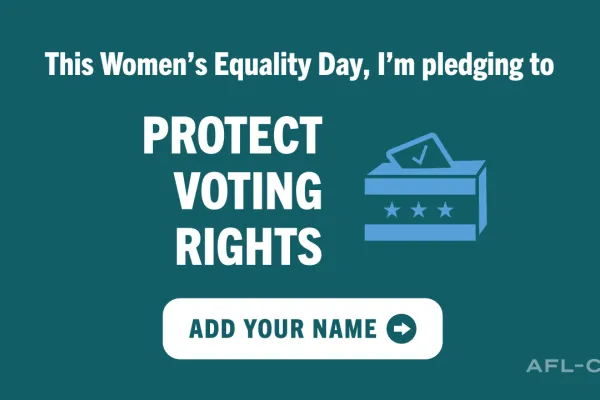 Green sign with white writing, 'Women's Equality Day pledging to Protect Voting Rights'