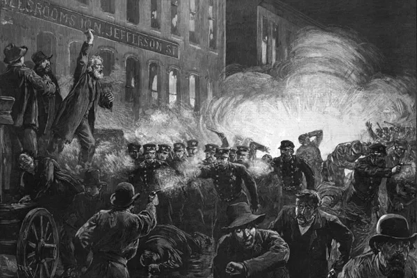 A historical illustration of the Haymarket Riots in black and white featuring workers protesting in front of a building and smoke