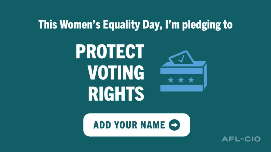 Green sign with white writing, 'Women's Equality Day pledging to Protect Voting Rights'